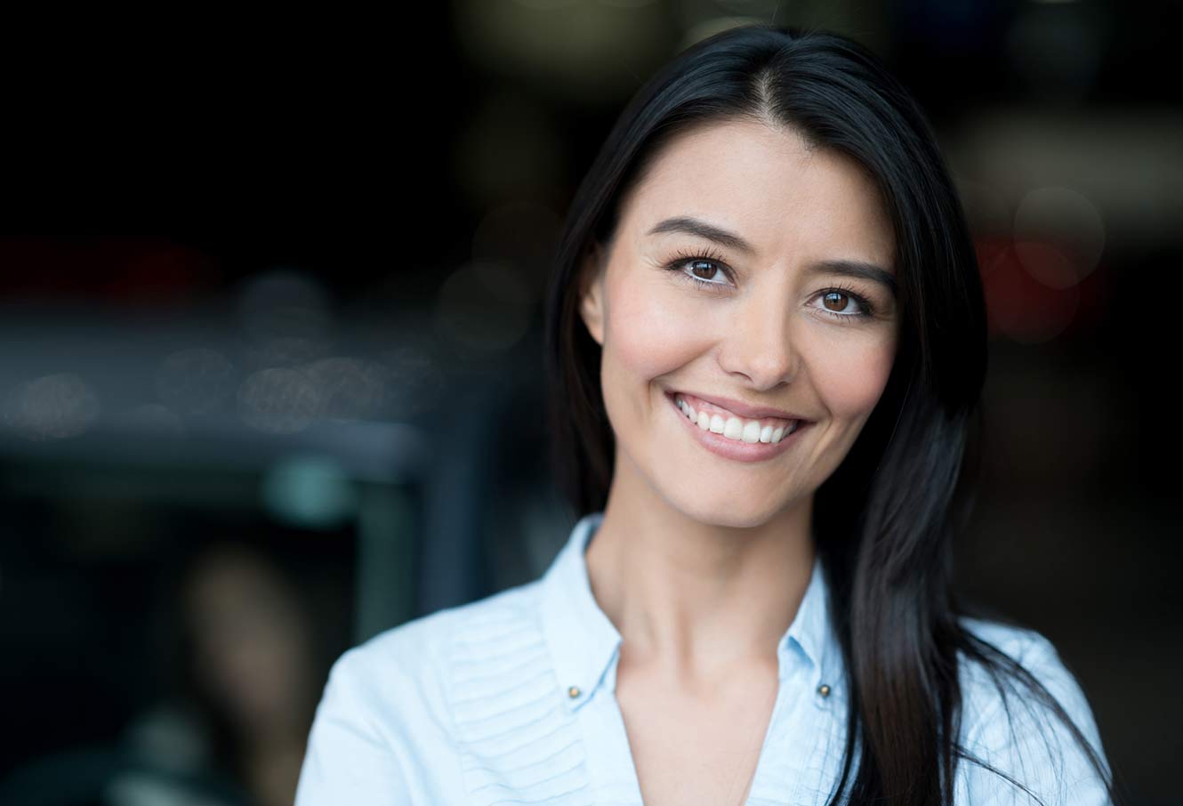 Young woman smiling.