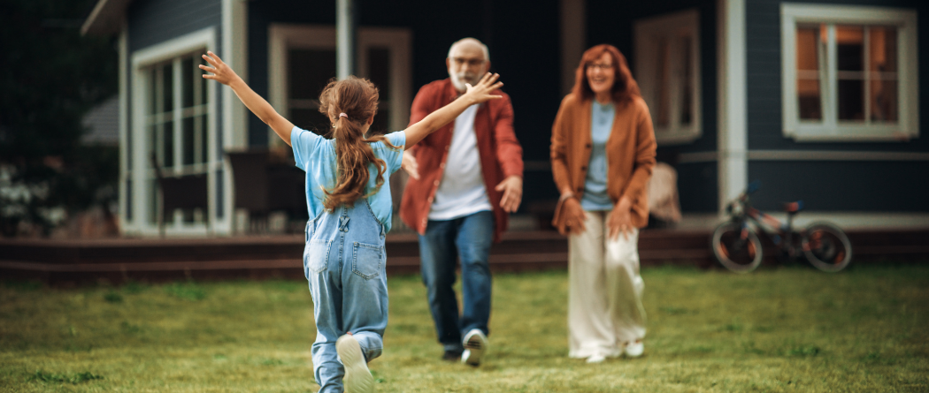 child running towards her grandparents